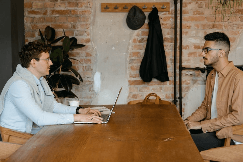 Two employees at a table